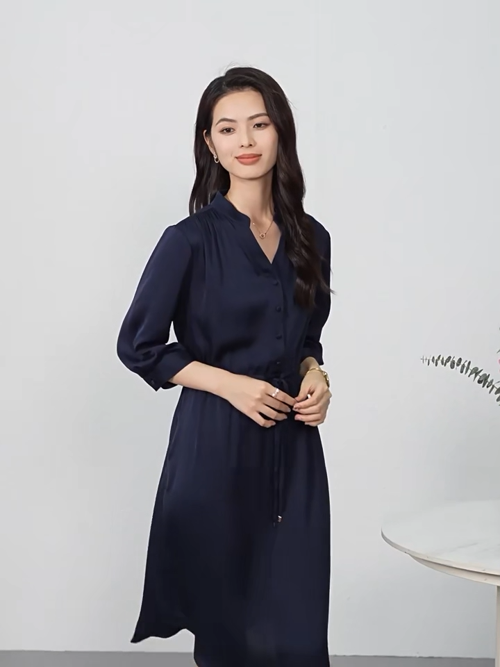 Video showcasing a double georgette silk dress in Monticola Solitarius and Behind the Clods colors, with a curved high-low hem, stand-up collar, and drawstring waist creating fluid drapes. — From Borcelleclothes.