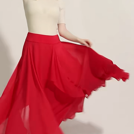 Video showcasing a Women's 12 Momme mulberry silk georgette maxi skirt in Wild Blush. A fluid silhouette featuring a free-flowing cascade panel integrated into the front seam. — From Borcelleclothes.