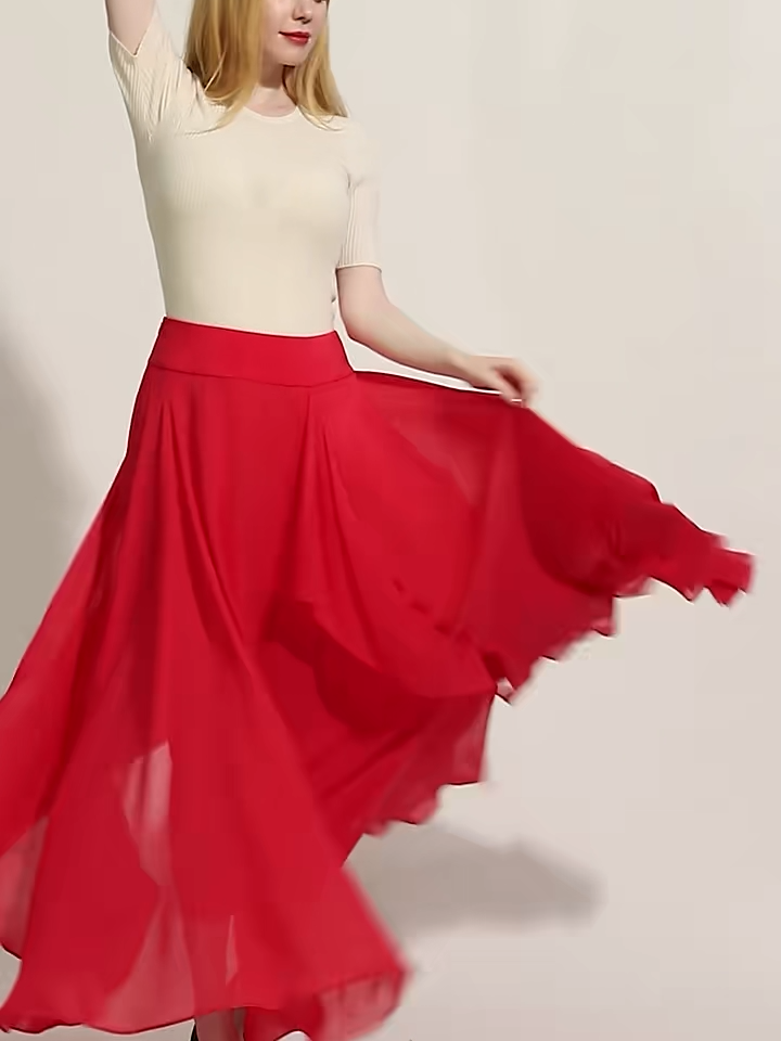 Video showcasing a Women's 12 Momme mulberry silk georgette maxi skirt in Wild Blush. A fluid silhouette featuring a free-flowing cascade panel integrated into the front seam. — From Borcelleclothes.