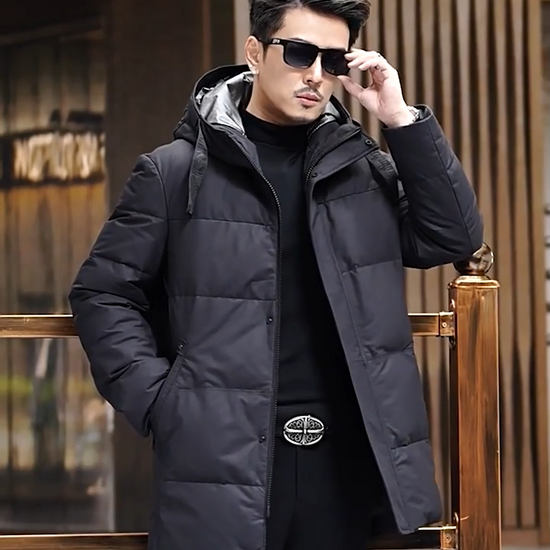 Video showcasing a Men's Matte cowhide down coat in Abyss, featuring  a wide hood belt, reflective lining, and concealed placket. From Borcelleclothes.