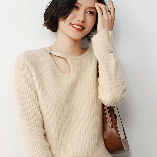 Video showcasing a Women's Loop neckline cashmere sweater in wide ribbed knit with slit cuffs, shown in Almond color — From Borcelleclothes.