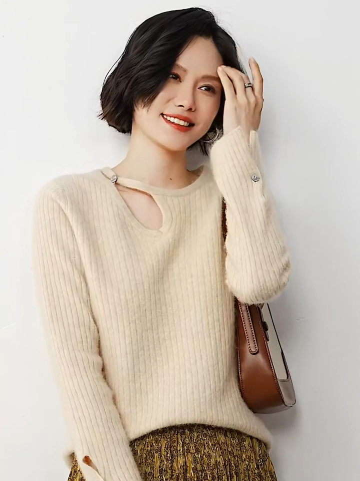 Video showcasing a Women's Loop neckline cashmere sweater in wide ribbed knit with slit cuffs, shown in Almond color — From Borcelleclothes.
