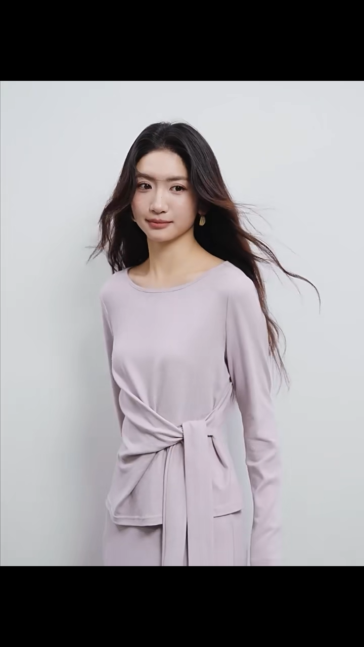 Video showcasing a Long-sleeve knit top with an origami knot and a midi skirt with scalloped lace, shown in Almost There color. — From Borcelleclothes.