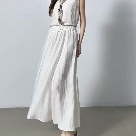 Video showcasing a Women's midi viscose-linen blend gathered skirt with a crinkled texture in Shurima Oasis and Azir Fog, featuring an elasticated waistband and side seam pockets. — From Borcelleclothes.