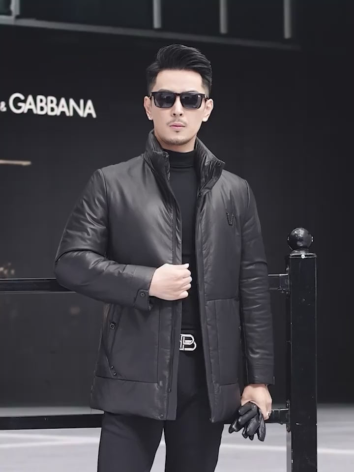 Video showcasing a Men’s cowhide leather down jacket in Onyx with set-in oversized pockets, grosgrain ribbon inserts, and decorative “V” badge — From Borcelleclothes.
