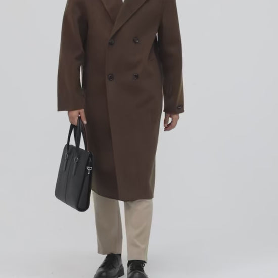 Video showcasing a Men’s double-faced wool coat in Espresso with notch lapels, double-breasted front, and hand-finished seams—crafted for quiet strength and lasting warmth. From Borcelleclothes.