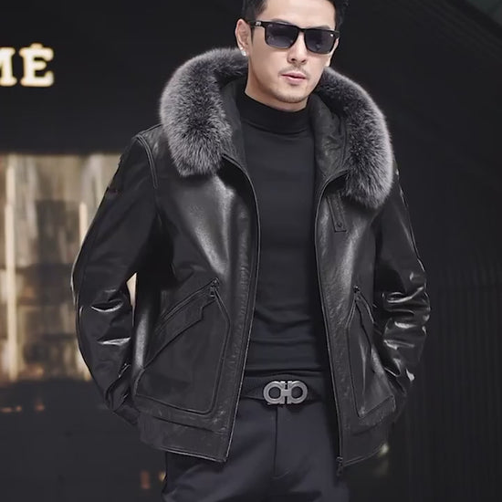 Video showcasing a Men’s cowhide leather coat in Onyx with detachable fox fur hood trim, piped curved pockets, badge detail, and snap cuffs. — From Borcelleclothes.