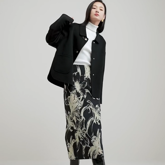 Video showcasing a Women's double-sided wool jacket in Willow Catkin and Black Cat colors, featuring decorative rectangular loops, golden C-shape snaps, and a softly arched side hem. — From Borcelleclothes.