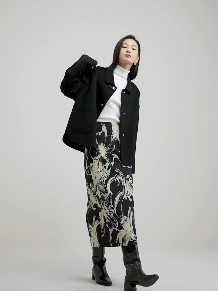 Video showcasing a Women's double-sided wool jacket in Willow Catkin and Black Cat colors, featuring decorative rectangular loops, golden C-shape snaps, and a softly arched side hem. — From Borcelleclothes.