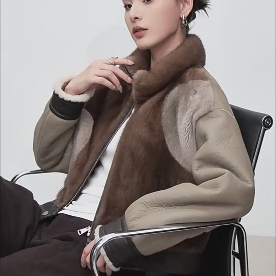 Video showcasing a Women’s cropped jacket in Cardamon Spice, combining real mink and genuine shearling, featuring asymmetrical patchwork and quilted leather accents. — From Borcelleclothes.