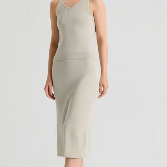 Video showcasing a Women's sculptural midi skirt in rib wool-silk blend with a discreet side slit. Straight silhouette in Compliant Sage and Silent Adept hues. — From Borcelleclothes.