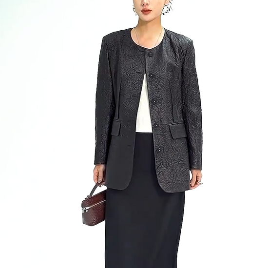 Video showcasing a Women's Full-grain sheepskin leather jacket in Crinkled Nocturne. Semi-fitted collarless design featuring exposed front darts and delicate pearl-centered woven buttons. — From Borcelleclothes.
