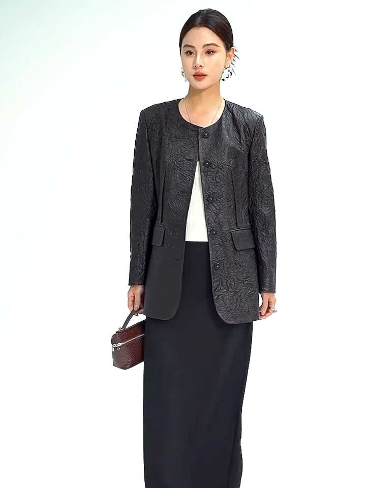 Video showcasing a Women's Full-grain sheepskin leather jacket in Crinkled Nocturne. Semi-fitted collarless design featuring exposed front darts and delicate pearl-centered woven buttons. — From Borcelleclothes.