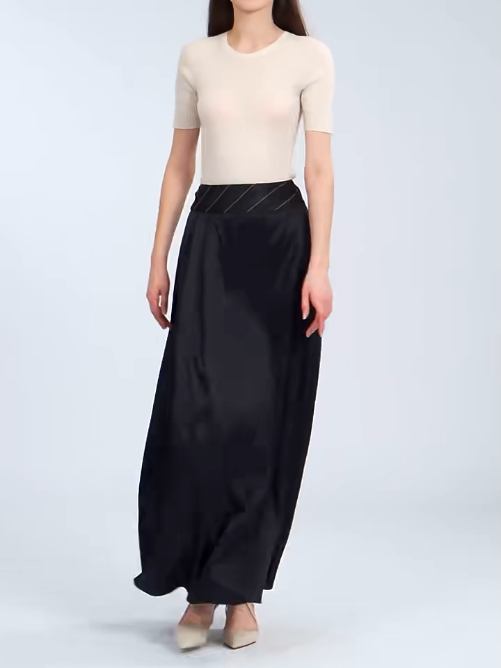 Video showcasing a Women's Heavy 40 momme Mulberry silk skirt. A pleated overlay fixed by contrast topstitching on a structured waist yoke. Floor-length in Deep Waters shade. — From Borcelleclothes.