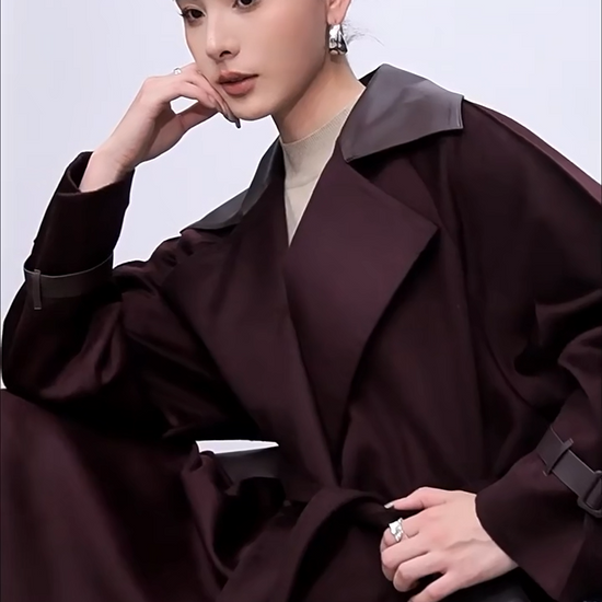 Video showcasing a Women's wrap flared wool coat in deep Bordeaux with sheepskin upper collar and architectural cuff details. — From Borcelleclothes.