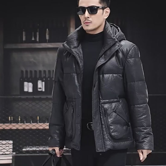 Video showcasing a Men’s compressed sheepskin down jacket in Onyx, with curved side patch pockets, decorative zippers, and sculptural collar-hood design.  —  From Borcelleclothes.