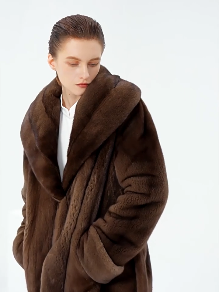 Video showcasing a Women's sheared mink coat with wide shawl collar and self-tie belt, shown in Eclipse. — From Borcelleclothes.