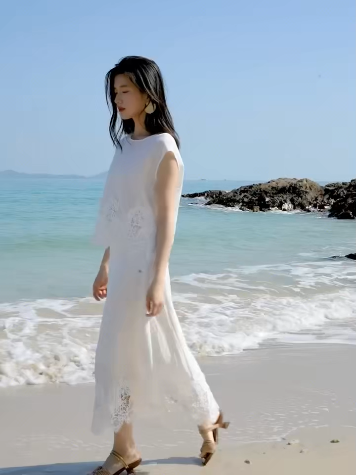 Video showcasing a Women's two-piece set featuring a cropped sleeveless top with a pearl button closure and a mid-calf A-line skirt. — From Borcelleclothes.