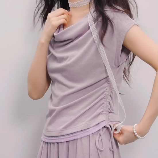 Video showcasing a Women's rib-knit set in Gentle Dream color: loose-fit sleeveless top with a voluminous cowl collar and midi flared skirt. — From Borcelleclothes.