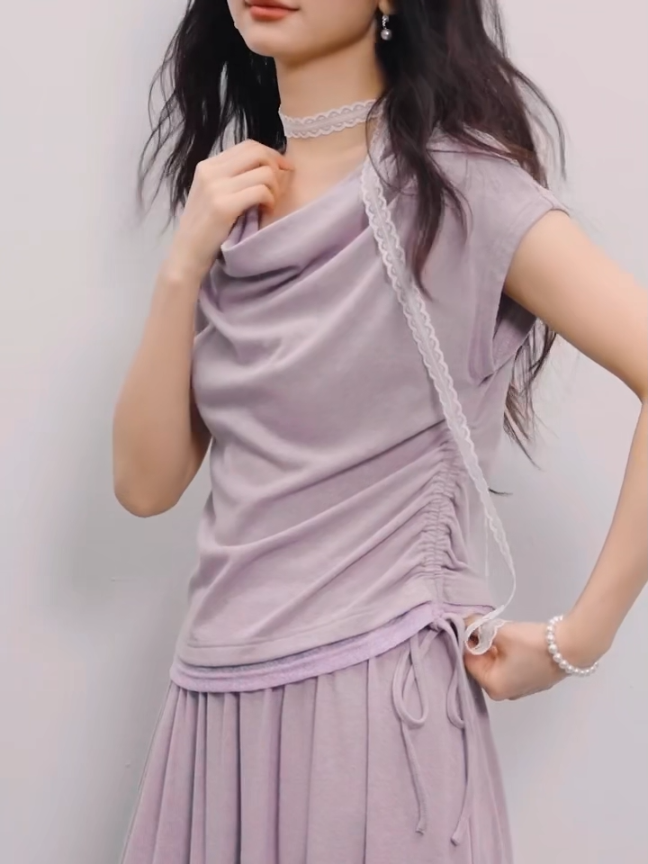 Video showcasing a Women's rib-knit set in Gentle Dream color: loose-fit sleeveless top with a voluminous cowl collar and midi flared skirt. — From Borcelleclothes.
