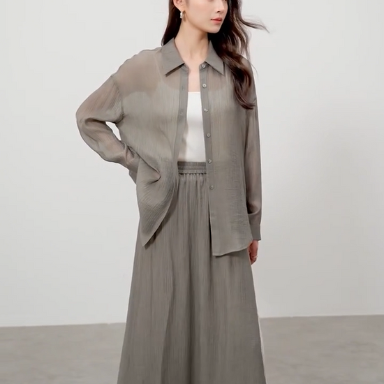 Video showcasing a Women's semi-sheer lyocell two piece set in Graphite Rain and Flight Pollen colors. Crinkled texture, fluid silhouette. — From Borcelleclothes.