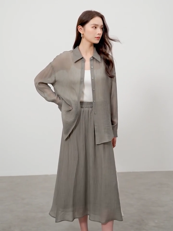 Video showcasing a Women's semi-sheer lyocell two piece set in Graphite Rain and Flight Pollen colors. Crinkled texture, fluid silhouette. — From Borcelleclothes.