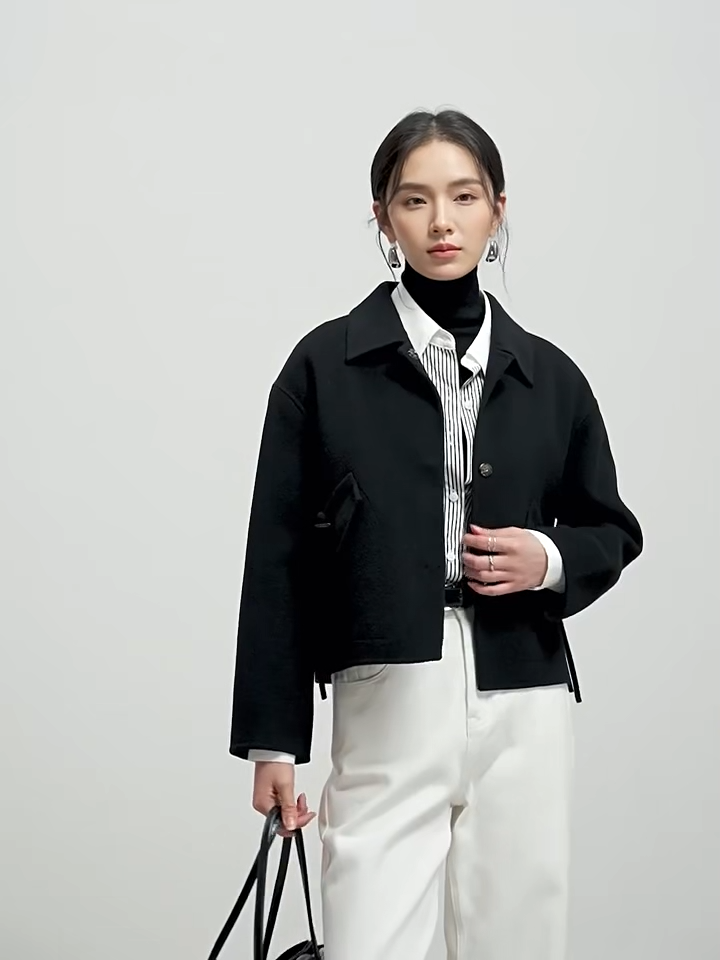 Video showcasing a Women's hand-finished double-sided wool jacket with decorative bone toggles and wool tassels. Shown in all colors. — From Borcelleclothes.