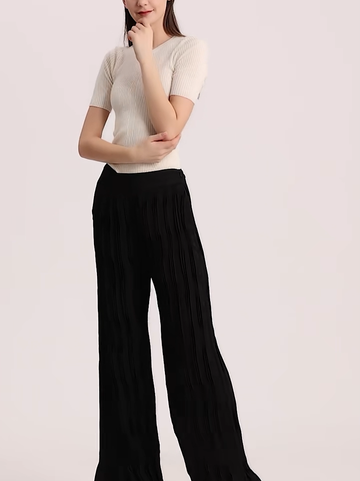 Video showcasing a Women's wide-leg Mulberry Silk Jacquard trousers in Hide-and-Seek featuring an asymmetrical high-low waist yoke with right insert and groups of vertical triple tucks. — From Borcelleclothes.