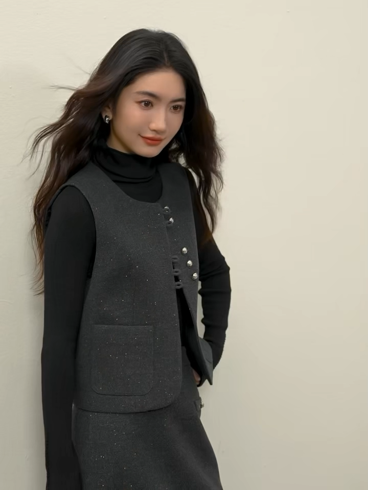 Video showcasing a Women's three-piece ensemble in knit (Syncopation color) and silver-lurex wool blend (Improvisation color). Features structural exposed seams, a single-breasted vest with syncopated button grouping, and a midi skirt. — From Borcelleclothes.