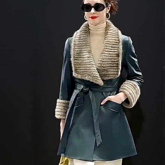 Video showcasing a Women's Sheepskin coat in Independence color, with rectangular striped mink collar, extended cuffs, wide welt pockets, and a self-tie belt. — From Borcelleclothes.