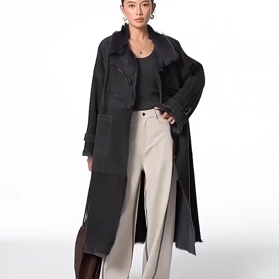 Video showcasing a Women's mid-calf goatskin coat in Inner Depth, with toggle closure on the diagonally arranged leather air loops; Toscana fur visible at uncut edges — From Borcelleclothes.