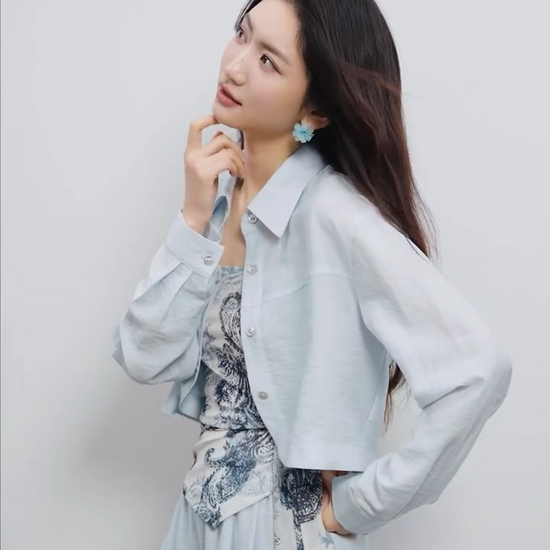 Video showcasing a Three-piece set in Lapis Shimmer. Noble lyocell and linen blend. Cropped shirt with rounded hem, draped wrap top with Cashew Flower texture, and wide-leg trousers. — From Borcelleclothes.