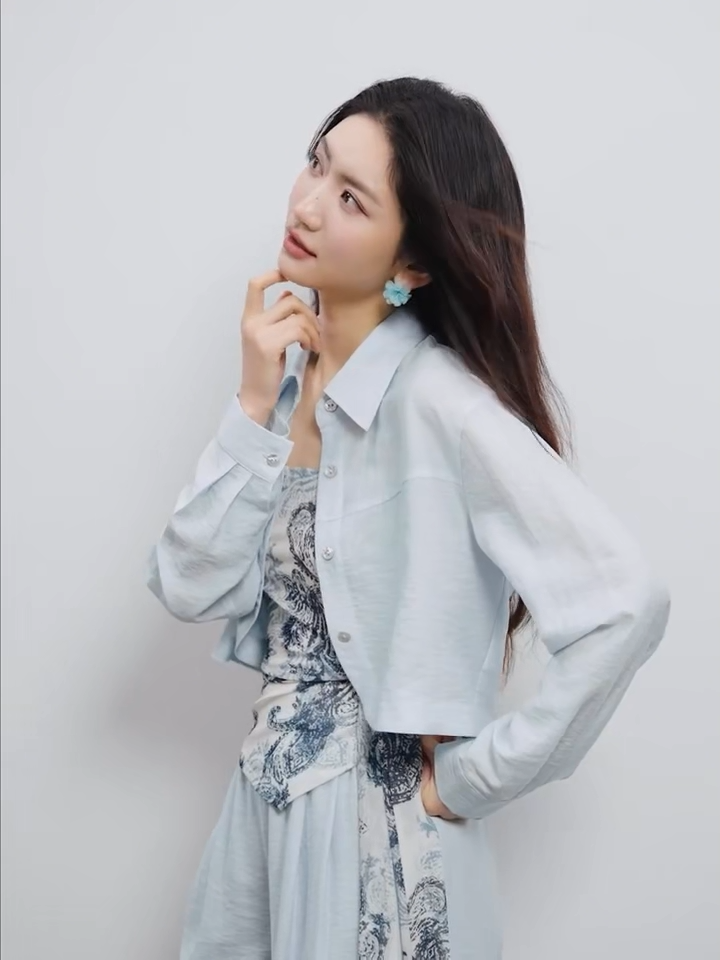 Video showcasing a Three-piece set in Lapis Shimmer. Noble lyocell and linen blend. Cropped shirt with rounded hem, draped wrap top with Cashew Flower texture, and wide-leg trousers. — From Borcelleclothes.