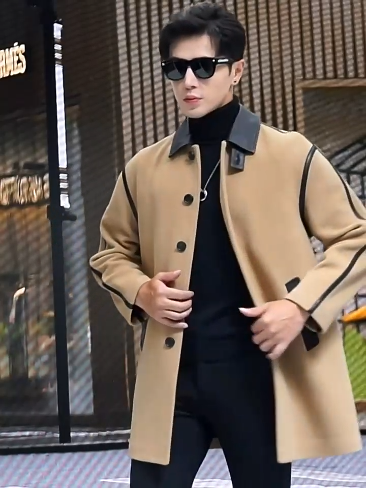 Video showcasing a Men’s urban leather-trim wool coat in Lion, with pointed leather collar, raglan sleeves, and graphic seam detailing — From Borcelleclothes.