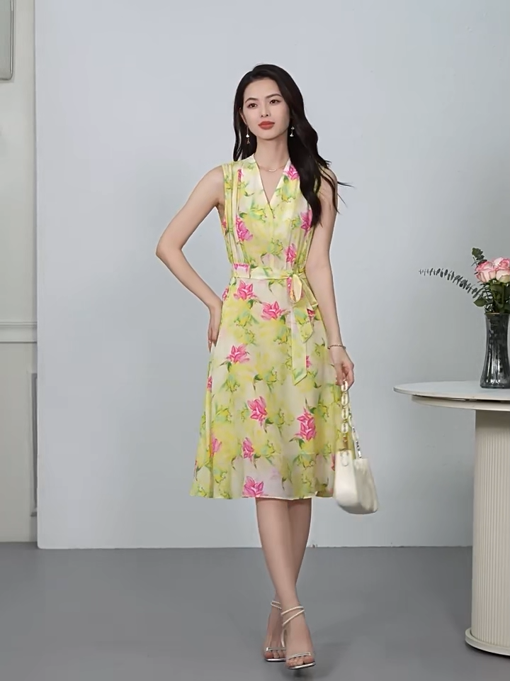 Video showcasing a Women's Sleeveless Mulberry Silk midi dress in Magnolia in May color, featuring a fixed wrap bodice, continuous-cut framed collar, and sculptural peripheral draping. — From Borcelleclothes.