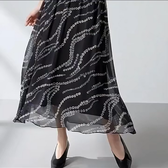 Video showcasing a Women's mid-calf flared gathered skirt crafted from Grade 6A Mulberry silk georgette in the Marguerite Octaves, featuring an invisible zipper and viscose lining. — From Borcelleclothes.