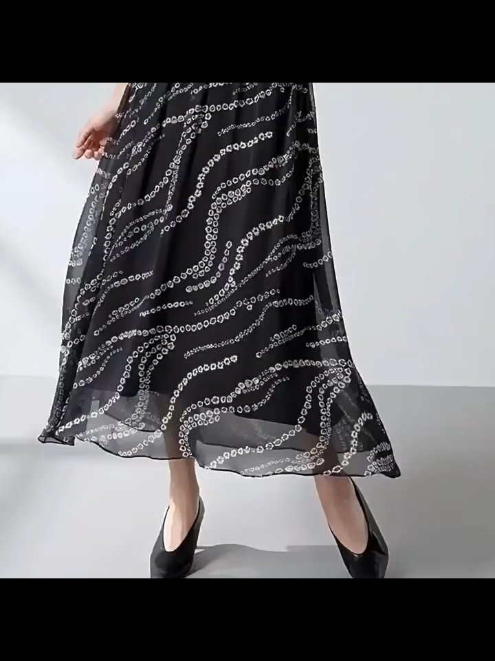 Video showcasing a Women's mid-calf flared gathered skirt crafted from Grade 6A Mulberry silk georgette in the Marguerite Octaves, featuring an invisible zipper and viscose lining. — From Borcelleclothes.