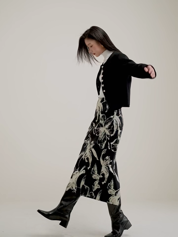 Video showcasing a Women's collarless double-sided wool jacket in Midnight Sax and Echo of Jazz colors, with sculptural golden buttons and hand-finished seams. — From Borcelleclothes.