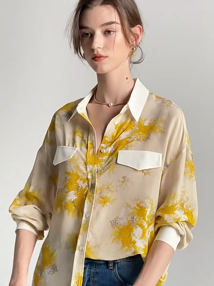   Video showcasing a women's 100% Mulberry Silk Mimosa Print Shirt. From Borcelleclothes.