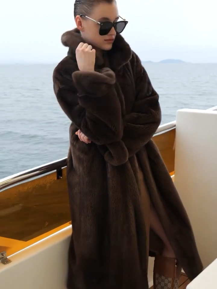 Video showcasing a Women’s minimalist full-length mink fur coat with clean silhouette, hidden hook closure, and seamless surface — shown in Mirage of Marron and White Echo. — From Borcelleclothes.