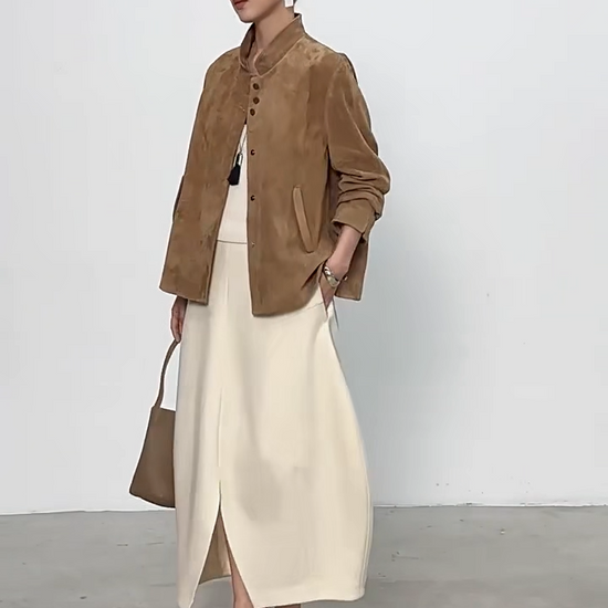 Video showcasing a Women's Full-Grain Sheepskin Suede Jacket in Moiré Trace. Features a powder-soft nap, straight silhouette, mandarin collar, and concealed snaps. — From Borcelleclothes.