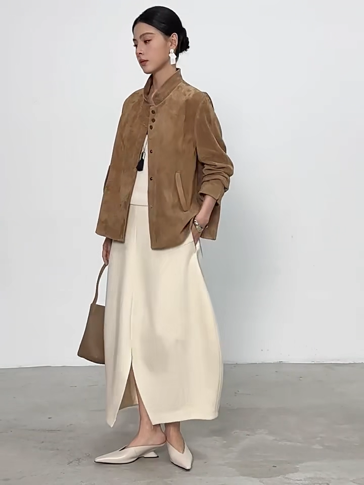 Video showcasing a Women's Full-Grain Sheepskin Suede Jacket in Moiré Trace. Features a powder-soft nap, straight silhouette, mandarin collar, and concealed snaps. — From Borcelleclothes.