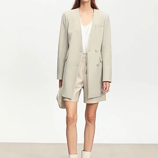 Video showcasing a Women’s Moon Mist wrap blazer with deep wrap, belt, and angled layered detail creating a quiet illusion of retro grace. From Borcelleclothes.