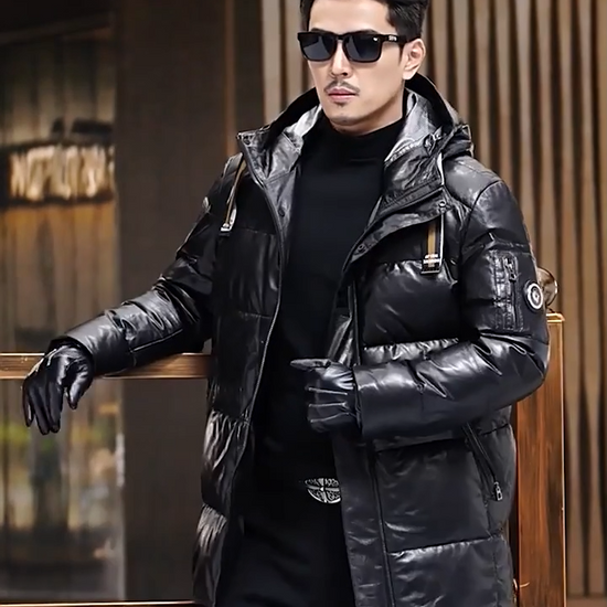 Video showcasing a Men's Onyx goatskin down coat with striped belt at hood, two-way zip into hood, diagonal zip pockets, reflective lining, mid-calf length — From Borcelleclothes.