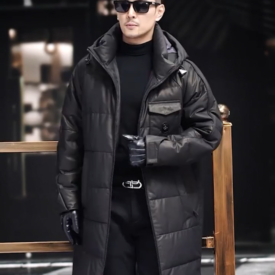 Video showcasing a Men’s cowhide down coat in Onyx color, with raglan sleeves and sculpted hood-collar design. From Borcelleclothes.