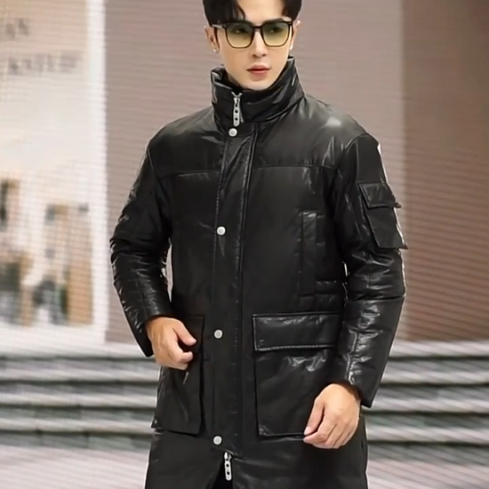 Video showcasing a Men’s structured cowhide coat in Onyx, with cargo pockets, stand collar, and two-way zipper. Goose down insulation. From Borcelleclothes.