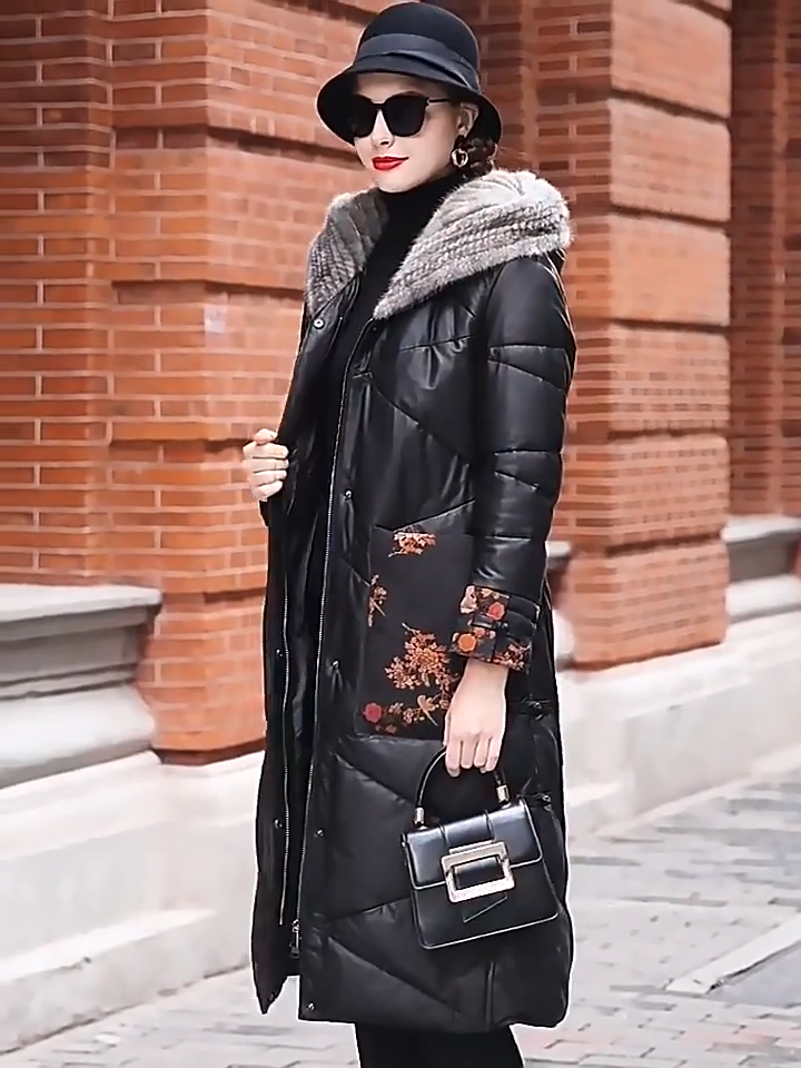 Video showcasing a Women's sheepskin coat in Onyx with mink-lined hood, printed floral leather cuffs and pockets, tonal zigzag quilting, and decorative knot closures — From Borcelleclothes.