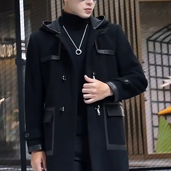 Video showcasing a Men’s hybrid wool-leather coat in Onyx, with hood, leather overlays, and distinctive swivel-clasp closures. From Borcelleclothes.