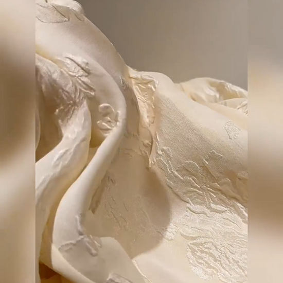 Video showcasing a Women's jacquard silk blouse in three colors with curved placket, fabric-covered buttons, and stepped cuffs. From Borcelleclothes.