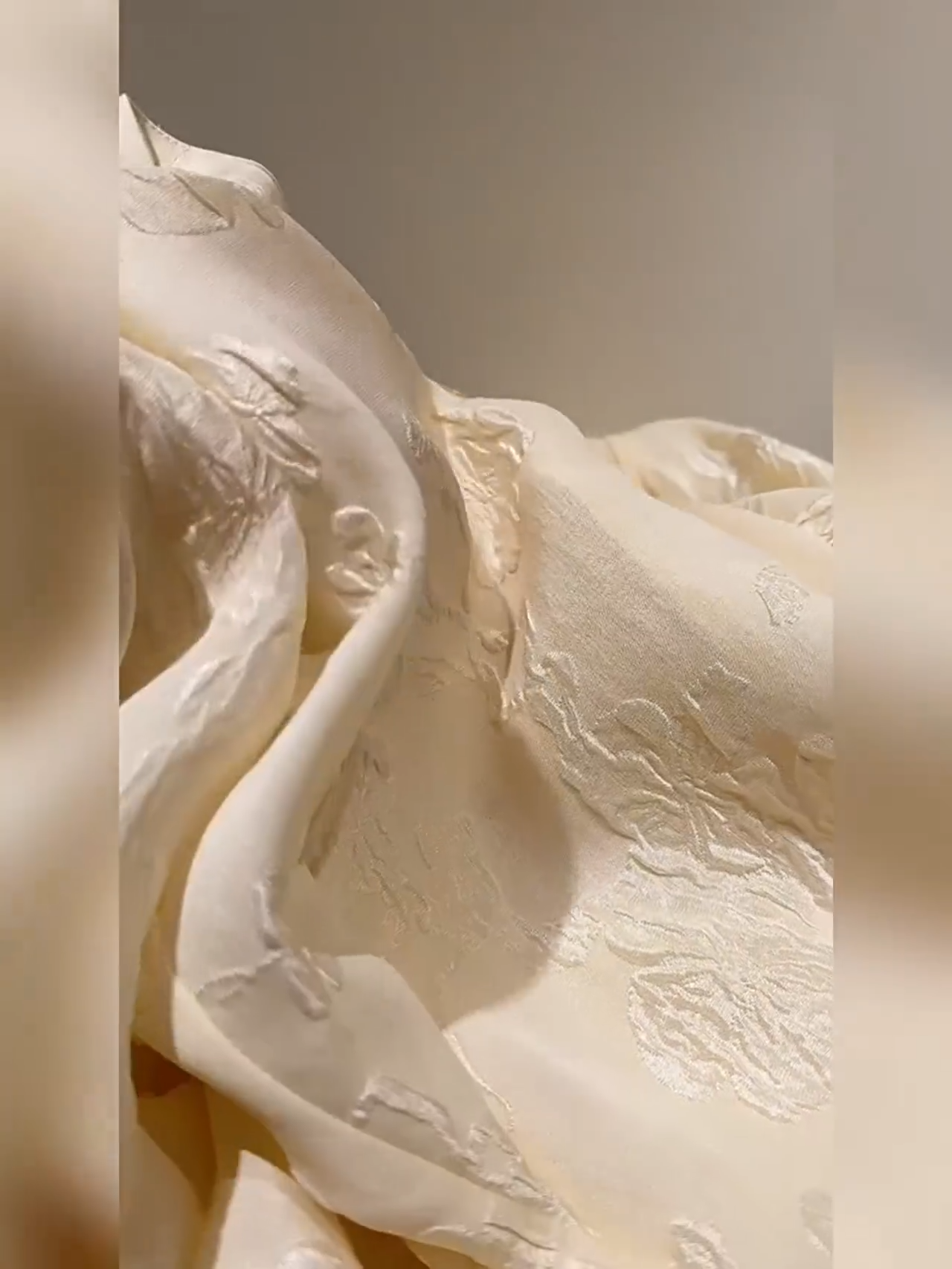 Video showcasing a Women's jacquard silk blouse in three colors with curved placket, fabric-covered buttons, and stepped cuffs. From Borcelleclothes.